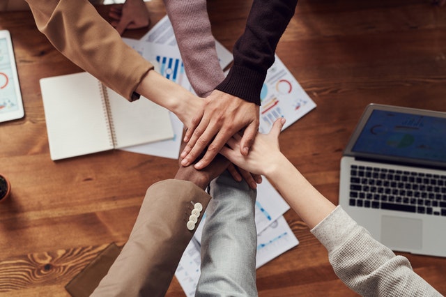 teamwork stacking hands