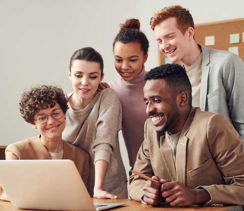 people smiling at computer
