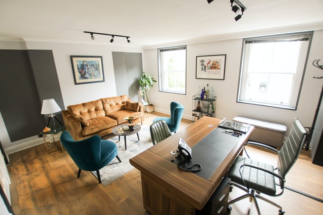 room with desk and couch